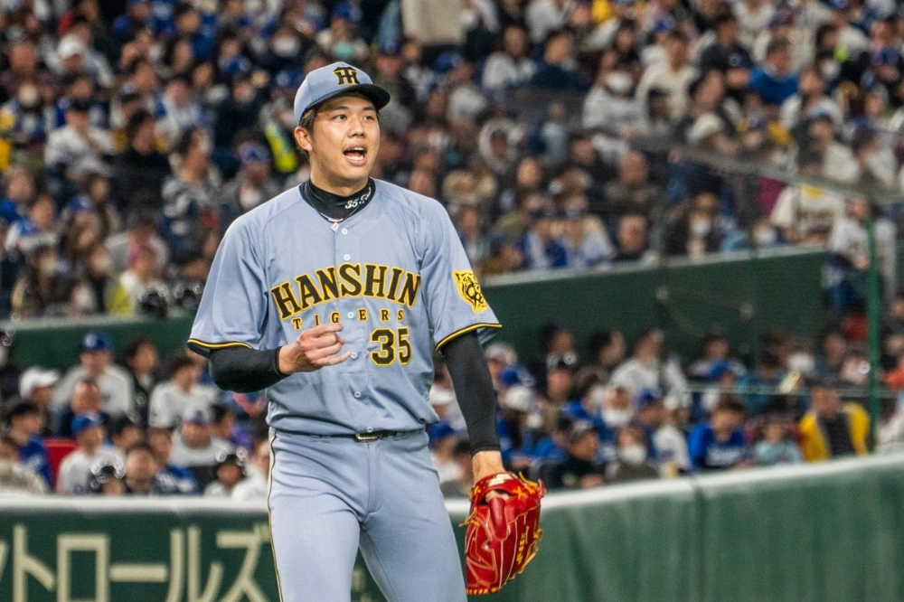 Hanshin pitcher Hiroto Saiki threw five scoreless innings as the Tigers topped the Dodgers in an exhibition game on Sunday in Tokyo.  Hanshin pitcher Hiroto Saiki threw five scoreless innings as the Tigers topped the Dodgers in an exhibition game on Sunday in Tokyo.