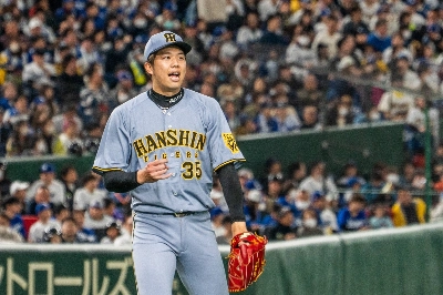 Hanshin pitcher Hiroto Saiki threw five scoreless innings as the Tigers topped the Dodgers in an exhibition game on Sunday in Tokyo.  Hanshin pitcher Hiroto Saiki threw five scoreless innings as the Tigers topped the Dodgers in an exhibition game on Sunday in Tokyo.