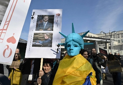 A protest called "America, wake up" is held in front of the U.S. Embassy in Kyiv on March 8, days after U.S. President Donald Trump paused American military and intelligence support for Ukraine. A protest called "America, wake up" is held in front of the U.S. Embassy in Kyiv on March 8, days after U.S. President Donald Trump paused American military and intelligence support for Ukraine.