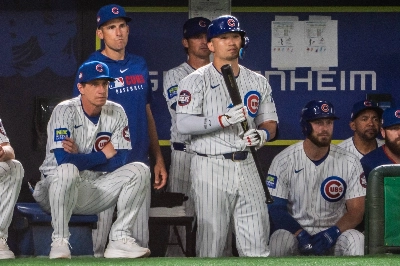Seiya Suzuki stands next to manager Craig Counsell in the Cubs dugout during their game against the Giants on Sunday. Seiya Suzuki stands next to manager Craig Counsell in the Cubs dugout during their game against the Giants on Sunday.