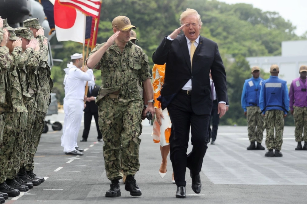 U.S. President Donald Trump reviews troops aboard the USS Wasp in Yokosuka, Japan, in May 2019. The shifting global security landscape has sparked discussions in many countries, including Japan, about developing nuclear weapons in response to changing U.S. commitments. U.S. President Donald Trump reviews troops aboard the USS Wasp in Yokosuka, Japan, in May 2019. The shifting global security landscape has sparked discussions in many countries, including Japan, about developing nuclear weapons in response to changing U.S. commitments.
