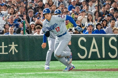 Shohei Ohtani runs home to score during the Dodgers' win over the Cubs in the MLB season opener at Tokyo Dome on Tuesday. Shohei Ohtani runs home to score during the Dodgers' win over the Cubs in the MLB season opener at Tokyo Dome on Tuesday.