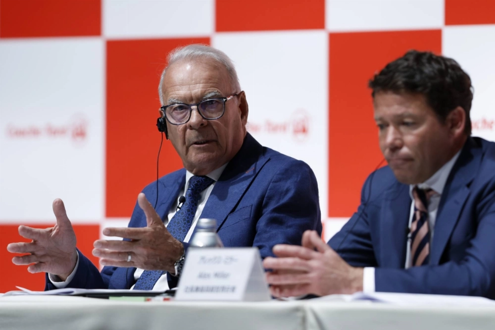 Alain Bouchard (left), chairman and founder of Alimentation Couche-Tard, speaks during a news conference in Tokyo on March 13. Alain Bouchard (left), chairman and founder of Alimentation Couche-Tard, speaks during a news conference in Tokyo on March 13.