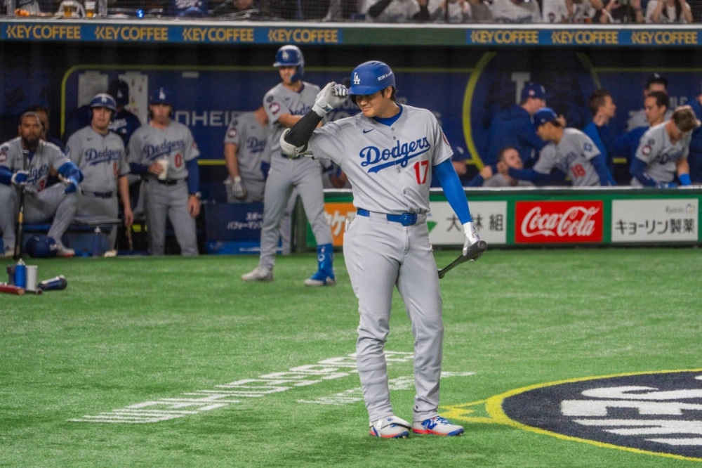 Shohei Ohtani tips his batting helmet during the opening game of the MLB season between the Dodgers and Cubs on Tuesday at Tokyo Dome  Shohei Ohtani tips his batting helmet during the opening game of the MLB season between the Dodgers and Cubs on Tuesday at Tokyo Dome