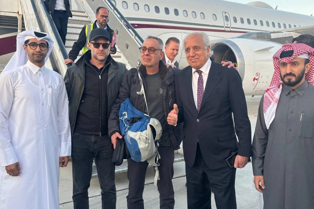 Delta Airlines mechanic George Glezmann (center) poses for a picture with U.S. hostage envoy Adam Boehler (second from left), former U.S. envoy to Afghanistan Zalmay Khalilzad (second from right) and Qatari diplomats in Kabul on Thursday, ahead of their departure to Doha.  Delta Airlines mechanic George Glezmann (center) poses for a picture with U.S. hostage envoy Adam Boehler (second from left), former U.S. envoy to Afghanistan Zalmay Khalilzad (second from right) and Qatari diplomats in Kabul on Thursday, ahead of their departure to Doha.