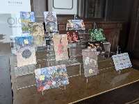 Marui Group's Museum Epos Cards — where donations are made to art museums based on the amount spent on the card — sit on display in Tokyo's Taito Ward on Friday. | Jiji