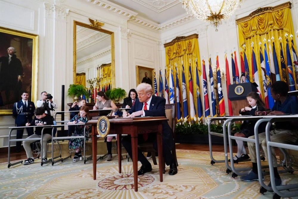U.S. President Donald Trump signs an executive order in the White House on Thursday directing the secretary of the Department of Education to take steps to close the agency. U.S. President Donald Trump signs an executive order in the White House on Thursday directing the secretary of the Department of Education to take steps to close the agency.