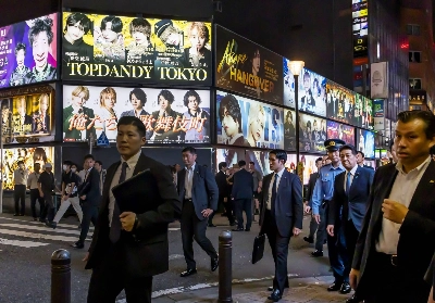 Officials of the National Public Safety Commission inspect the Kabukicho area of Shinjuku, Tokyo, in June 2024, as crimes committed by unscrupulous host clubs have surfaced. Officials of the National Public Safety Commission inspect the Kabukicho area of Shinjuku, Tokyo, in June 2024, as crimes committed by unscrupulous host clubs have surfaced.