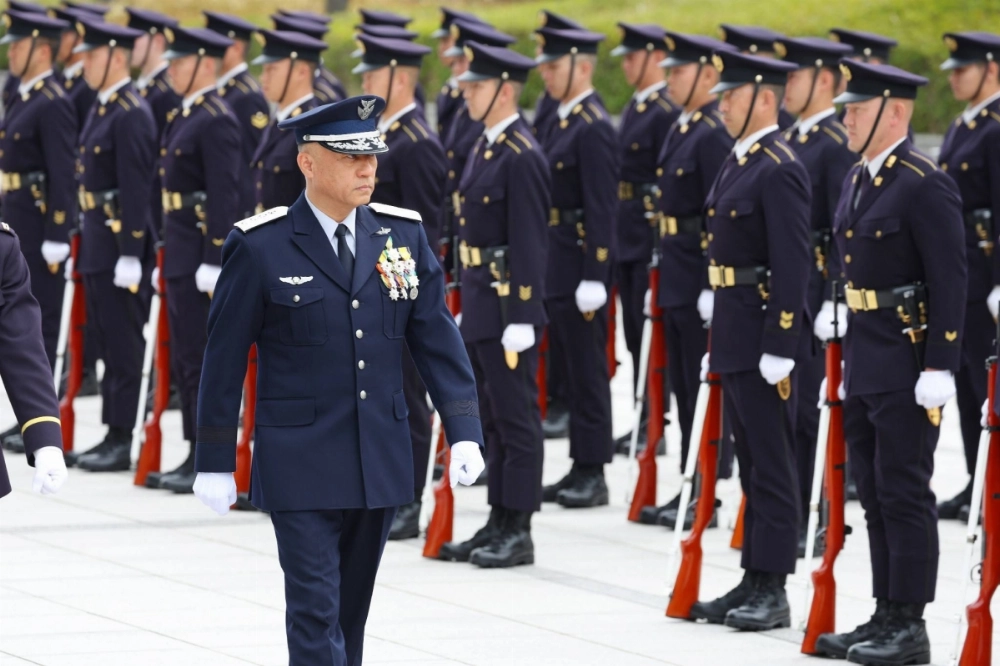 The head of the Self-Defense Forces' new Joint Operations Command, Gen. Kenichiro Nagumo, inspects an honor guard Monday morning at the Defense Ministry in Tokyo. The head of the Self-Defense Forces' new Joint Operations Command, Gen. Kenichiro Nagumo, inspects an honor guard Monday morning at the Defense Ministry in Tokyo.