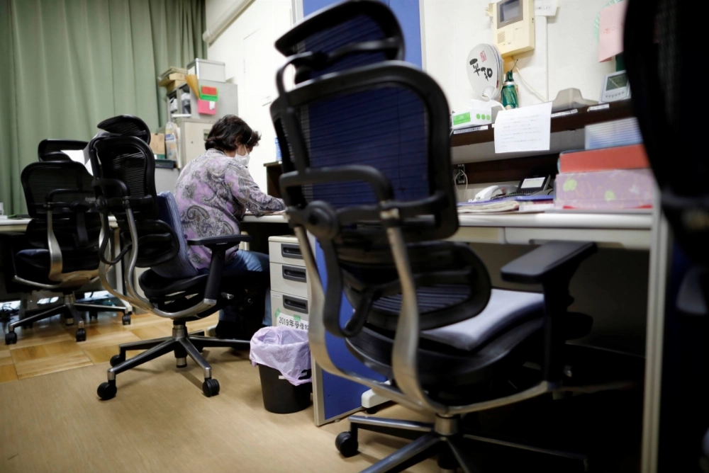 A volunteer handles an incoming call at the Tokyo Befrienders call center, a suicide hotline center in Japan's capital. A volunteer handles an incoming call at the Tokyo Befrienders call center, a suicide hotline center in Japan's capital.