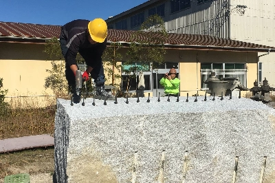 A worker cuts Inada granite, which is used in various buildings in Tokyo. A worker cuts Inada granite, which is used in various buildings in Tokyo.
