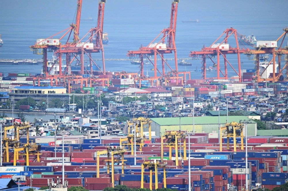Containers and cranes at the international port of Manila on Thursday. Containers and cranes at the international port of Manila on Thursday.