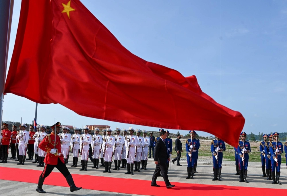 Cambodian Prime Minister Hun Manet (center) walks past honor guards during the inauguration ceremony for the the modernized Ream Naval Base in Cambodia's Preah Sihanouk province on Saturday. Cambodian Prime Minister Hun Manet (center) walks past honor guards during the inauguration ceremony for the the modernized Ream Naval Base in Cambodia's Preah Sihanouk province on Saturday.