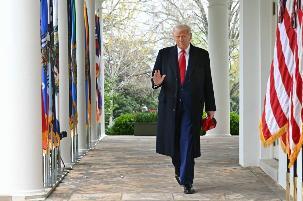 U.S. President Donald Trump waves as he walks to deliver remarks on reciprocal tariffs during an event in the Rose Garden entitled "Make America Wealthy Again" at the White House in Washington on Wednesday. U.S. President Donald Trump waves as he walks to deliver remarks on reciprocal tariffs during an event in the Rose Garden entitled "Make America Wealthy Again" at the White House in Washington on Wednesday.