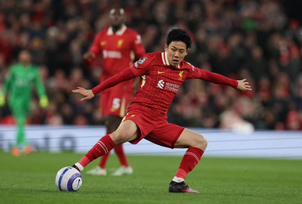 Liverpool's Wataru Endo controls the ball during a match against Newcastle in Liverpool on Feb. 26. Liverpool's Wataru Endo controls the ball during a match against Newcastle in Liverpool on Feb. 26.