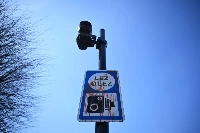 A vandalized sign indicating an ultralow emission zone in west London. | AFP-Jiji