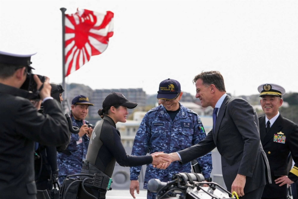NATO Secretary-General Mark Rutte meets with members of an explosives disposal team while inspecting equipment aboard the Maritime Self-Defense Force’s Mogami frigate at the Yokosuka Base in Kanagawa Prefecture on Tuesday. NATO Secretary-General Mark Rutte meets with members of an explosives disposal team while inspecting equipment aboard the Maritime Self-Defense Force’s Mogami frigate at the Yokosuka Base in Kanagawa Prefecture on Tuesday.