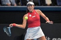 Japan's Moyuka Uchijima hits a return during a match against Romania's Anca Todoni as part of a Billie Jean King Cup qualifier in Tokyo on Saturday.  | AFP-JIJI