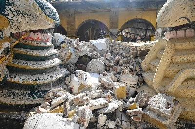 Damaged Buddha statues are surrounded by debris from collapsed buildings in Mandalay, Myanmar, on Saturday following the devastating March 28 earthquake.  Damaged Buddha statues are surrounded by debris from collapsed buildings in Mandalay, Myanmar, on Saturday following the devastating March 28 earthquake.