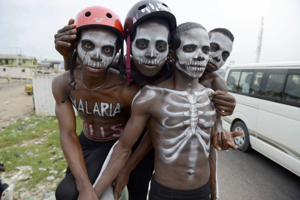 Men painted like skeletons pose in Lagos to warn on the deadly disease prior to the World Malaria Day on April 25, 2015. The sudden dismantling of USAID, the country's main foreign development arm, is unraveling health care systems across Africa.  Men painted like skeletons pose in Lagos to warn on the deadly disease prior to the World Malaria Day on April 25, 2015. The sudden dismantling of USAID, the country's main foreign development arm, is unraveling health care systems across Africa.