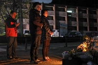 Shinobu Yamato (right), the mother of Hikaru Yamato who died in the 2016 Kumamoto earthquake, mourns her son along with Hikaru's brother Shogo in Minamiaso, Kumamoto Prefecture, on Wednesday. | Jiji
