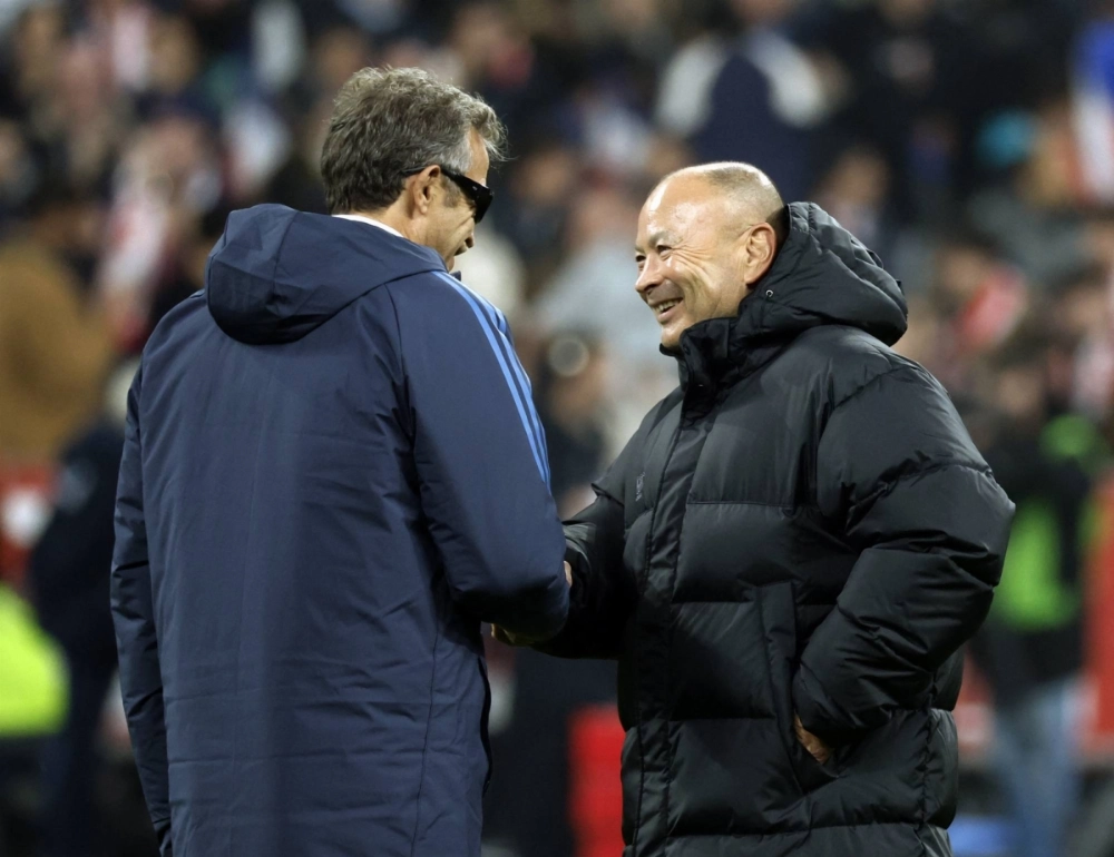 Japan coach Eddie Jones (right) shakes hands with France coach Fabien Galthie before a match in Saint-Denis, France, on Nov. 9, 2024. Japan coach Eddie Jones (right) shakes hands with France coach Fabien Galthie before a match in Saint-Denis, France, on Nov. 9, 2024.