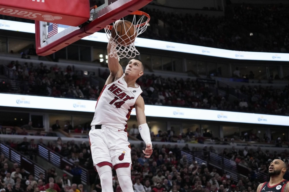 Heat guard Tyler Herro dunks against the Bulls during their play-in game in Chicago on Wednesday. Heat guard Tyler Herro dunks against the Bulls during their play-in game in Chicago on Wednesday.