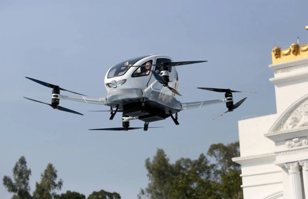 An autonomous aerial vehicle designed to carry one passenger conducts a test flight in Guangzhou, China. Flying taxis and even drone-powered food delivery services are rapidly becoming realities in the country's government-backed "low-altitude economy." An autonomous aerial vehicle designed to carry one passenger conducts a test flight in Guangzhou, China. Flying taxis and even drone-powered food delivery services are rapidly becoming realities in the country's government-backed "low-altitude economy."