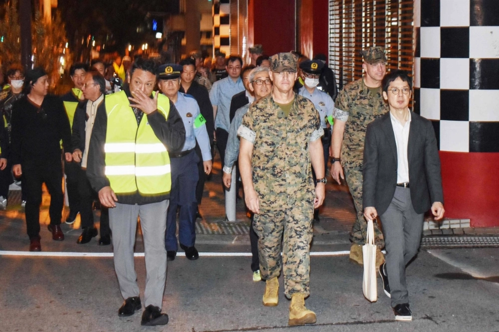 U.S. military personnel join Japanese officials and residents for a one-off joint nighttime patrol on the streets of the city of Okinawa, in Okinawa Prefecture, late Friday in the first such joint operation since 1973, following sexual assault cases involving U.S. servicemen.  U.S. military personnel join Japanese officials and residents for a one-off joint nighttime patrol on the streets of the city of Okinawa, in Okinawa Prefecture, late Friday in the first such joint operation since 1973, following sexual assault cases involving U.S. servicemen.