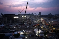 Rescue personnel search for survivors trapped in the rubble of a collapsed building in Bangkok on April 2, five days after an earthquake struck central Myanmar and Thailand. Thai authorities say they have arrested a Chinese executive at a company that was building the skyscraper. | AFP-JIJI