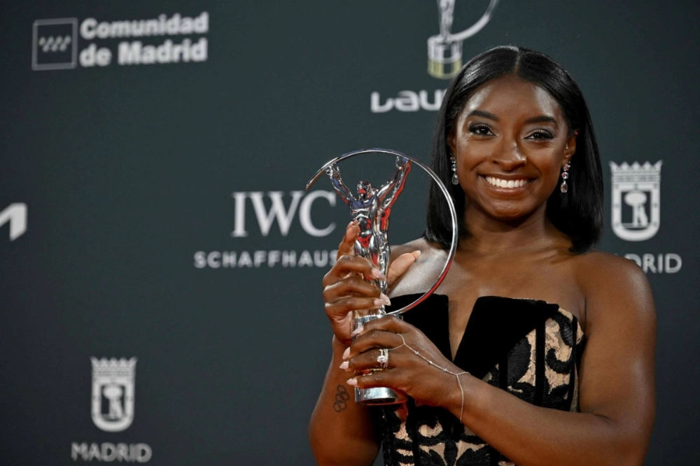 Gymnast Simone Biles poses with her Sportswoman of the Year Award during the 26th Laureus World Sports Awards gala in Madrid on Monday. Gymnast Simone Biles poses with her Sportswoman of the Year Award during the 26th Laureus World Sports Awards gala in Madrid on Monday.