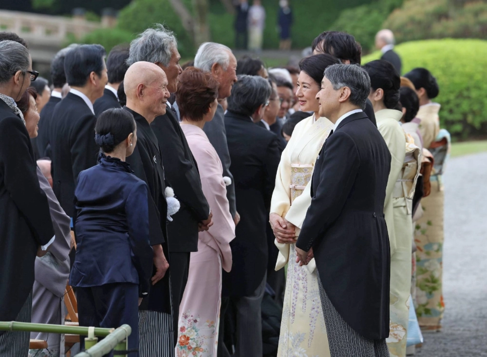 Emperor Naruhito and Empress Masako host a garden party at the Akasaka Imperial Gardens in Tokyo's Minato Ward on Tuesday. Emperor Naruhito and Empress Masako host a garden party at the Akasaka Imperial Gardens in Tokyo's Minato Ward on Tuesday.