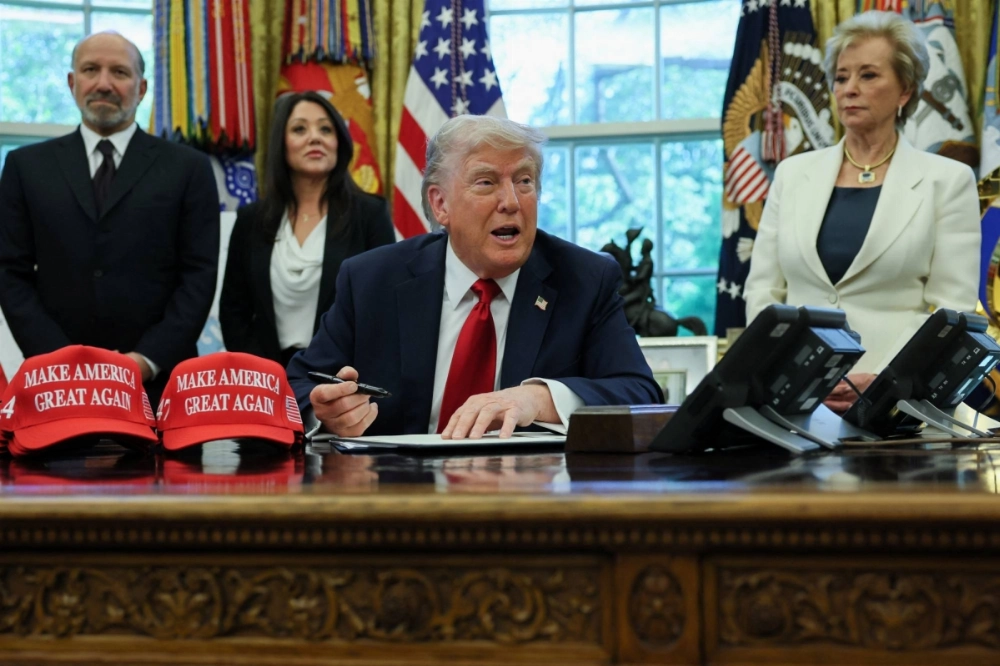 U.S. President Donald Trump signs an executive order in the Oval Office on Wednesday. His push for quick wins through tariffs and other measures is risking trade turmoil with key allies like Japan. U.S. President Donald Trump signs an executive order in the Oval Office on Wednesday. His push for quick wins through tariffs and other measures is risking trade turmoil with key allies like Japan.