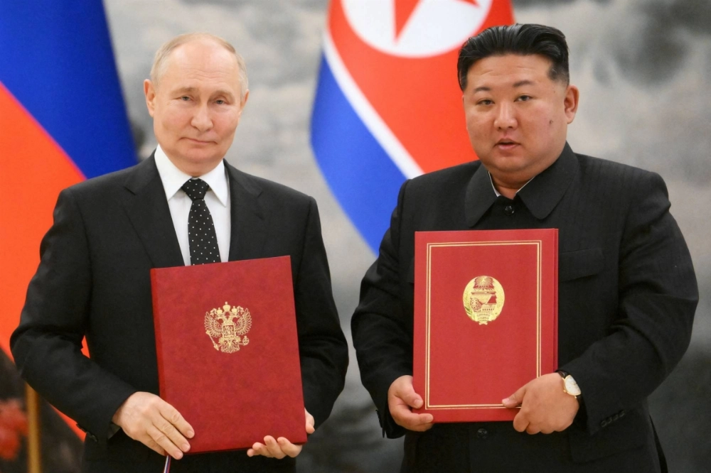 Russian President Vladimir Putin and North Korean leader Kim Jong Un pose for a photo during a signing ceremony following bilateral talks in Pyongyang last June. Russian President Vladimir Putin and North Korean leader Kim Jong Un pose for a photo during a signing ceremony following bilateral talks in Pyongyang last June.
