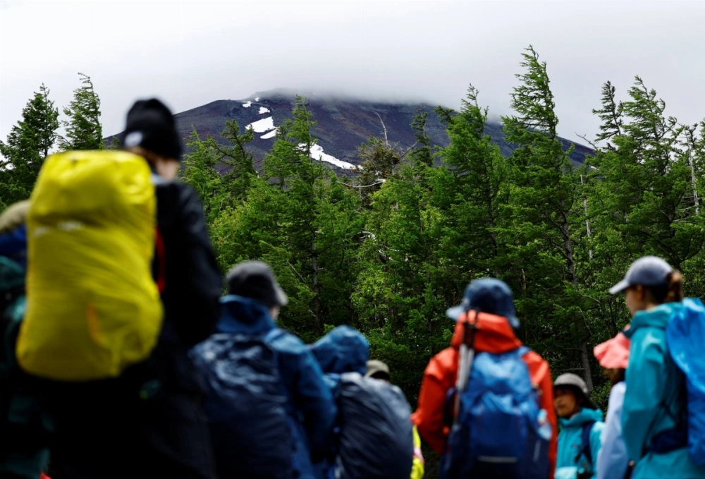 Climbers gather on the first day of the climbing season on the Yoshida Trail at the fifth station on the slopes of Mount Fuji in Fujiyoshida, Yamanashi Prefecture, on July 1, 2024. Climbers gather on the first day of the climbing season on the Yoshida Trail at the fifth station on the slopes of Mount Fuji in Fujiyoshida, Yamanashi Prefecture, on July 1, 2024.