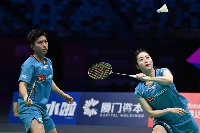 Yuichi Shimogami (left) and Sayaka Hobara hit a return to France's Gregoire Deschamp and Elsa Jacob during their mixed doubles match in the Sudirman Cup in Xiamen, China, on Tuesday. | AFP-JIJI