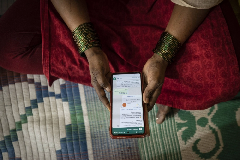 A woman takes part in an OpenNyAI field trial in Bengaluru, India, in April 2023. The AI trial was aimed at helping some of the nation’s poorest people access money from government anti-poverty programs. A woman takes part in an OpenNyAI field trial in Bengaluru, India, in April 2023. The AI trial was aimed at helping some of the nation’s poorest people access money from government anti-poverty programs.