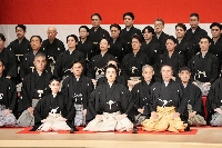 Kabuki actor Onoe Kikunosuke V, now Onoe Kikugoro VIII (front center), gives a greeting during the classical hand-clapping ceremony called "koshiki kaoyose teuchishiki" in Tokyo's Chuo Ward on Tuesday. | Shochiku / via jiji