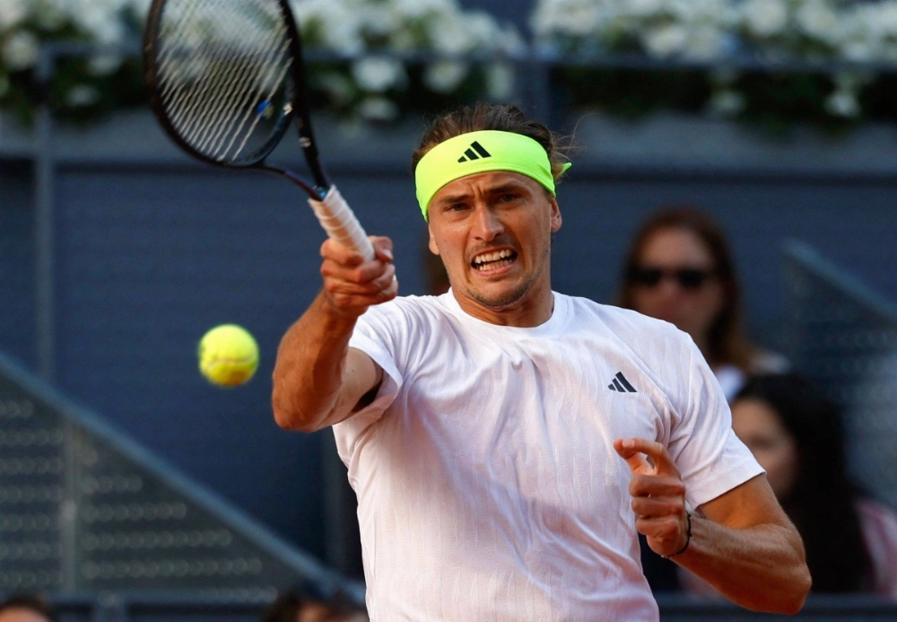 Germany's Alexander Zverev hits a return to Argentina's Francisco Cerundolo during their fourth round match at the Madrid Open on Tuesday.  Germany's Alexander Zverev hits a return to Argentina's Francisco Cerundolo during their fourth round match at the Madrid Open on Tuesday.