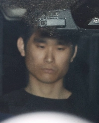 Hiroyuki Taniuchi in the city of Saitama while being sent to prosecutors on April 16 | Jiji