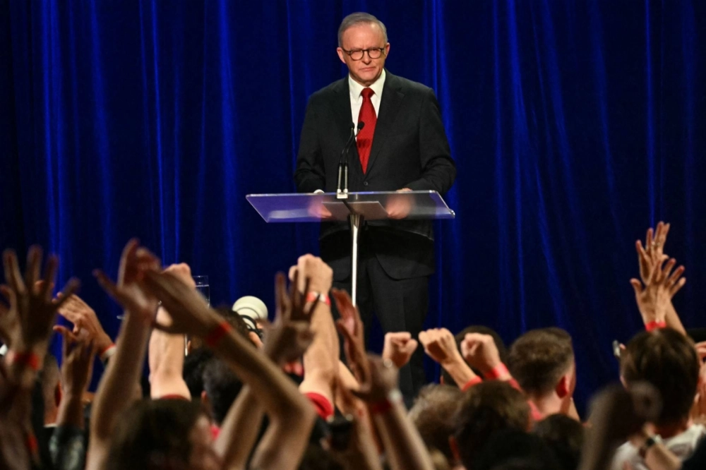 Australia's Prime Minister Anthony Albanese speaks onstage after winning the general election, at the Labor Party's election night event in Sydney on Saturday.  Australia's Prime Minister Anthony Albanese speaks onstage after winning the general election, at the Labor Party's election night event in Sydney on Saturday.