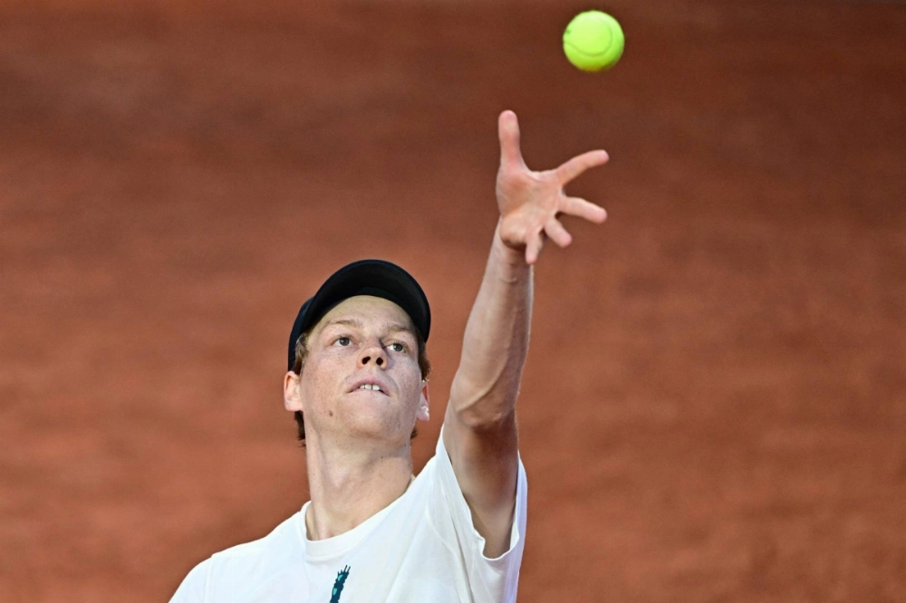 Italy's Jannik Sinner serves during a training session in Rome on Monday ahead of his return to tennis at the Italian Open.  Italy's Jannik Sinner serves during a training session in Rome on Monday ahead of his return to tennis at the Italian Open.