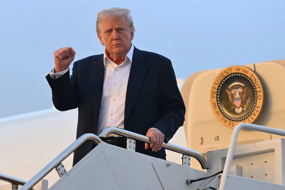 U.S. President Donald Trump disembarks from Air Force One upon arrival at Joint Base Andrews in Maryland on Sunday. U.S. President Donald Trump disembarks from Air Force One upon arrival at Joint Base Andrews in Maryland on Sunday.