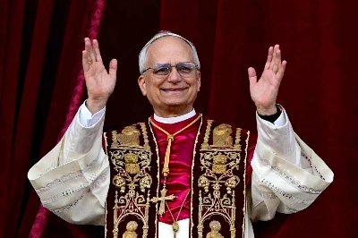 Newly elected Pope Leo XIV waves from the balcony of St. Peter's Basilica  in Vatican City, on Thursday. Newly elected Pope Leo XIV waves from the balcony of St. Peter's Basilica  in Vatican City, on Thursday.