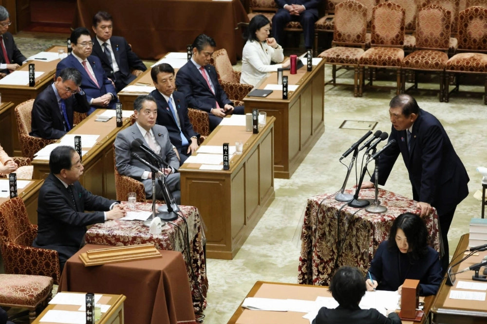 Prime Minister Shigeru Ishiba (right) responds to questions from Constitutional Democratic Party of Japan leader Yoshihiko Noda (left) at a Lower House Budget Committee meeting on April 14. Prime Minister Shigeru Ishiba (right) responds to questions from Constitutional Democratic Party of Japan leader Yoshihiko Noda (left) at a Lower House Budget Committee meeting on April 14.