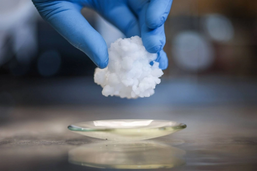 A staff member holds a barocaloric material used by Barocal in their solid state cooling technology, at their headquarters in Cambridge. A staff member holds a barocaloric material used by Barocal in their solid state cooling technology, at their headquarters in Cambridge.
