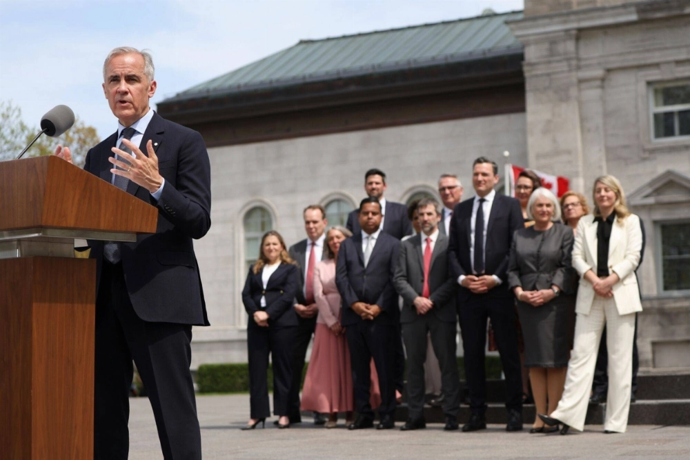Canadian Prime Minister Mark Carney speaks during a news conference with Cabinet members after a swearing-in ceremony at Rideau Hall in Ottawa, Ontario, Canada, on Tuesday. Canadian Prime Minister Mark Carney speaks during a news conference with Cabinet members after a swearing-in ceremony at Rideau Hall in Ottawa, Ontario, Canada, on Tuesday.