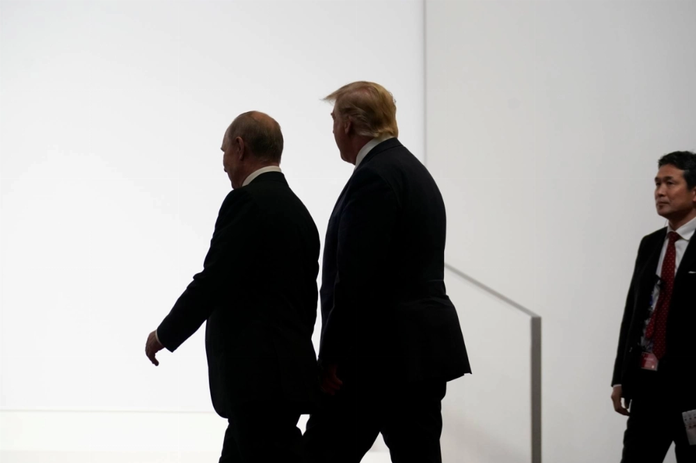 Russia's President Vladimir Putin and U.S. President Donald Trump walk during the G20 leaders summit in Osaka on June 28, 2019.   Russia's President Vladimir Putin and U.S. President Donald Trump walk during the G20 leaders summit in Osaka on June 28, 2019.
