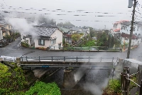 Houses along canal with heavy steam and mist in Beppu, Oita Prefecture. The Meteorological Agency announced the arrival of rainy season in the southern part of the Kyushu region, making it the first time the season began in the area before any other region since records began in 1951. | GETTY IMAGES