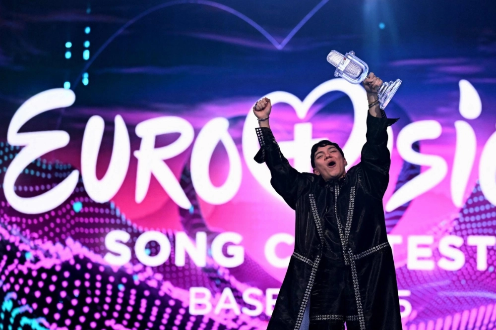 Austrian singer Johannes Pietsch, known as JJ, celebrates with the 2025 Eurovision Song Contest trophy after winning the grand final at the St. Jakobshalle arena in Basel, Switzerland, on Sunday. Austrian singer Johannes Pietsch, known as JJ, celebrates with the 2025 Eurovision Song Contest trophy after winning the grand final at the St. Jakobshalle arena in Basel, Switzerland, on Sunday.